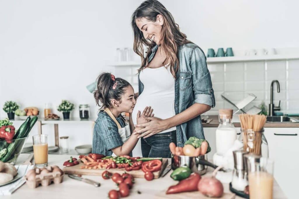 mother and daughter cooking in the kitchen